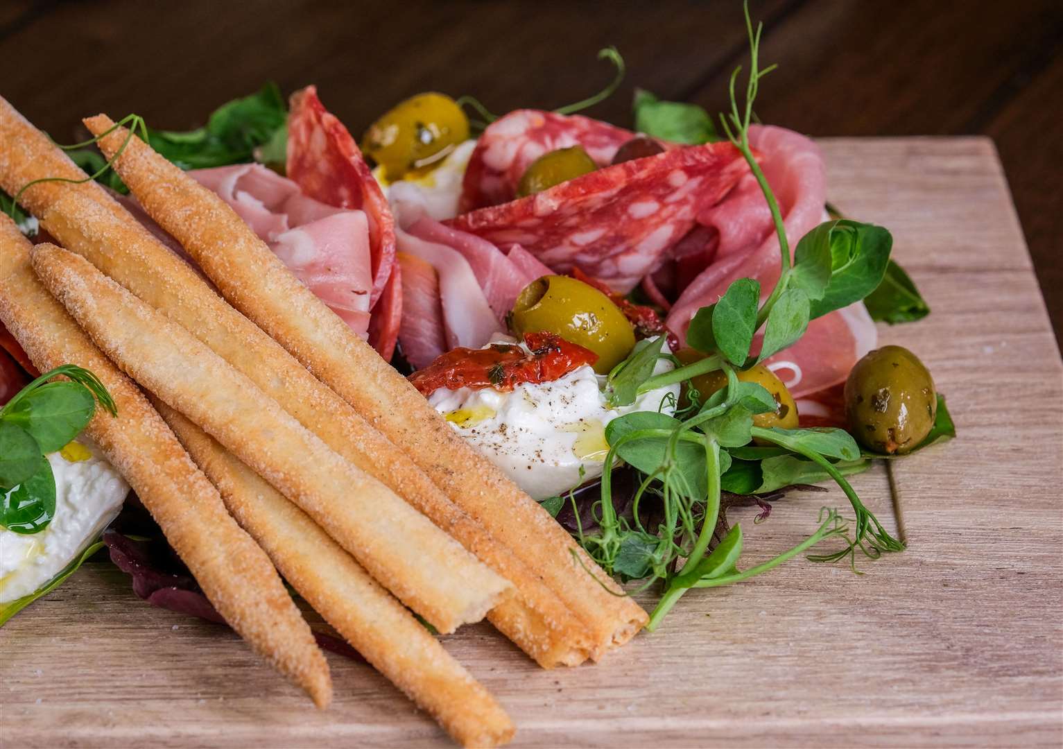 Italian sharing board for two with Italian cured meats, olives, grissini and mozzarella (£14)