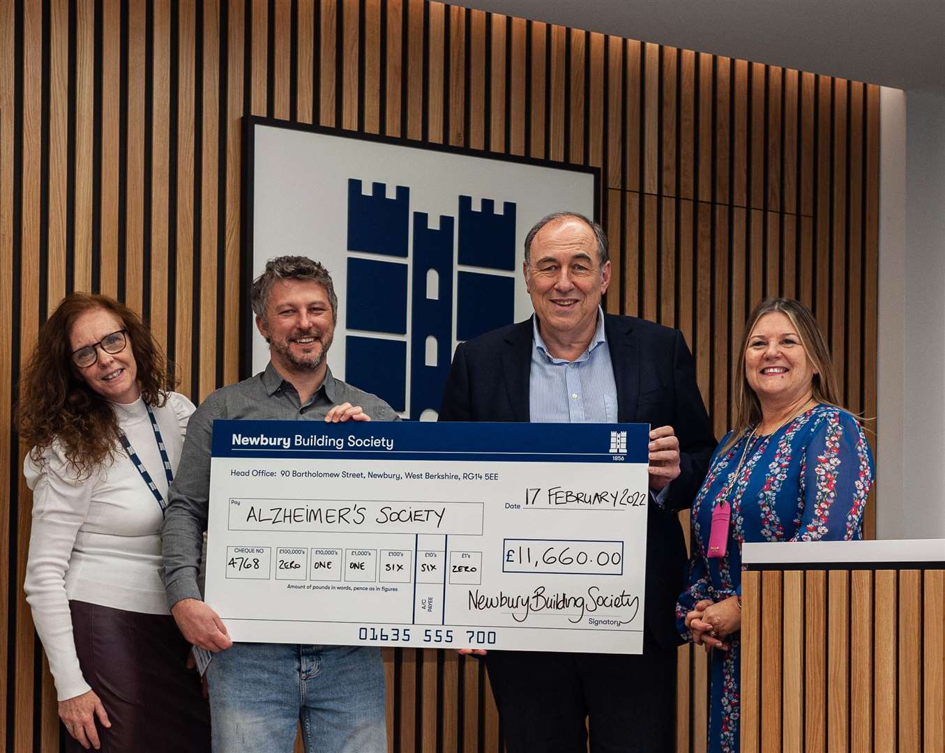 Roland Gardner, Traci Sharp, and Debbie Springer presenting the sizeable cheque to Tim Waters from Alzheimer’s Society