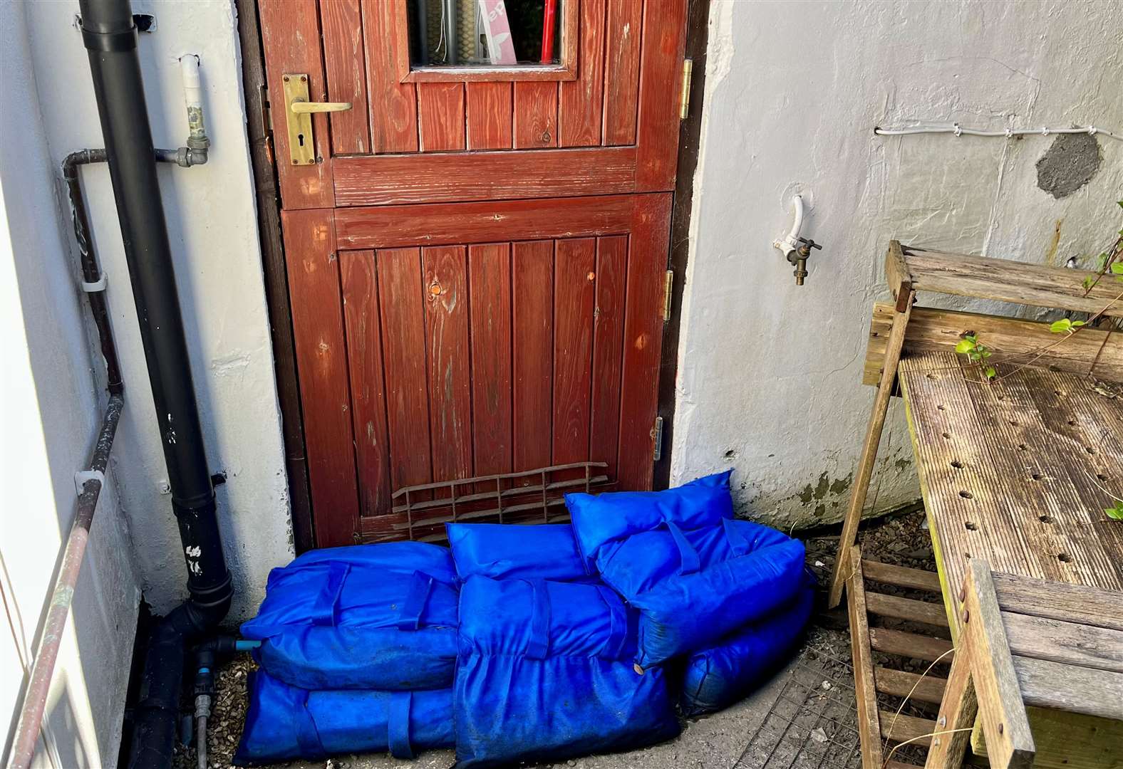 Mrs Howlett barricaded her back door to stop sewage entering her house. Credit: Mirek Gosney