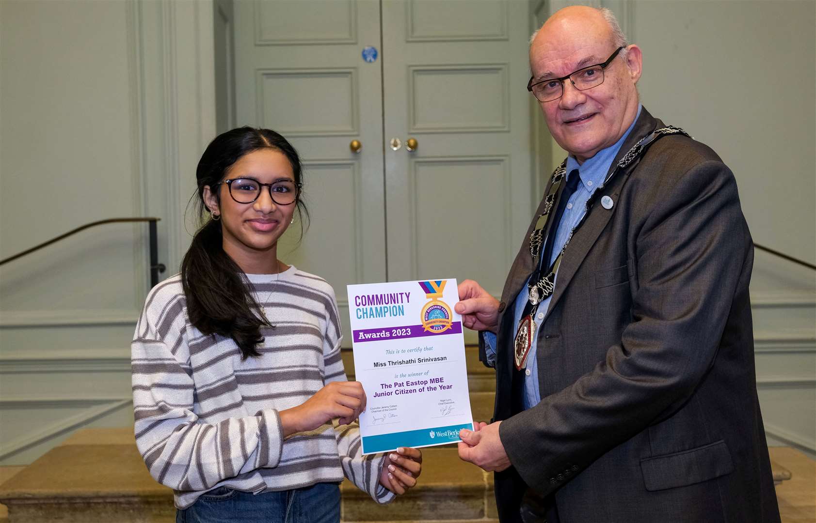 Winner of The Pat Eastop MBE Junior Citizen of the Year Thrishathi Srinivasan and chairman of West Berkshire Council Jeremy Cottam