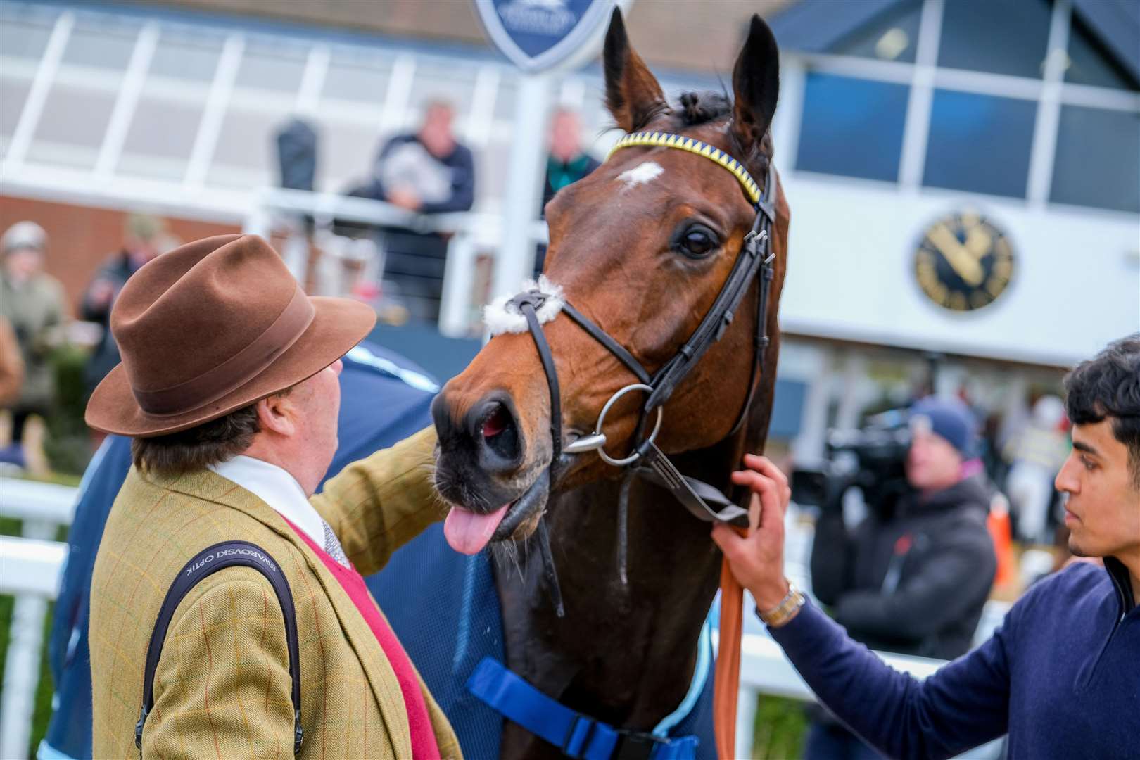 Nicky Henderson congratulates Willmount after his impressive hurdling debut. Picture by Phil Cannings