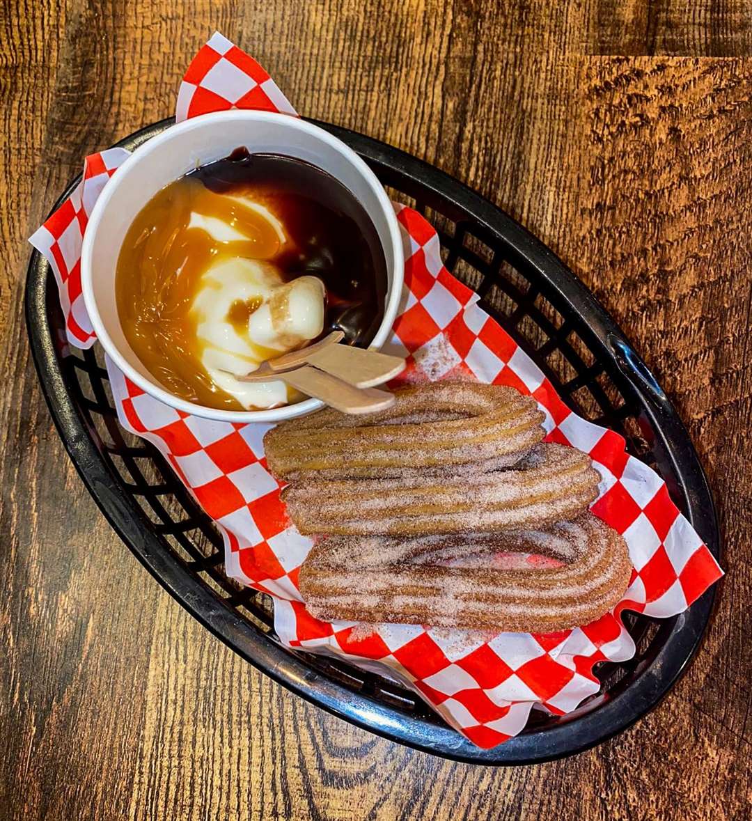 Churros with ice cream, chocolate sauce and salted caramel sauce (£6.50)