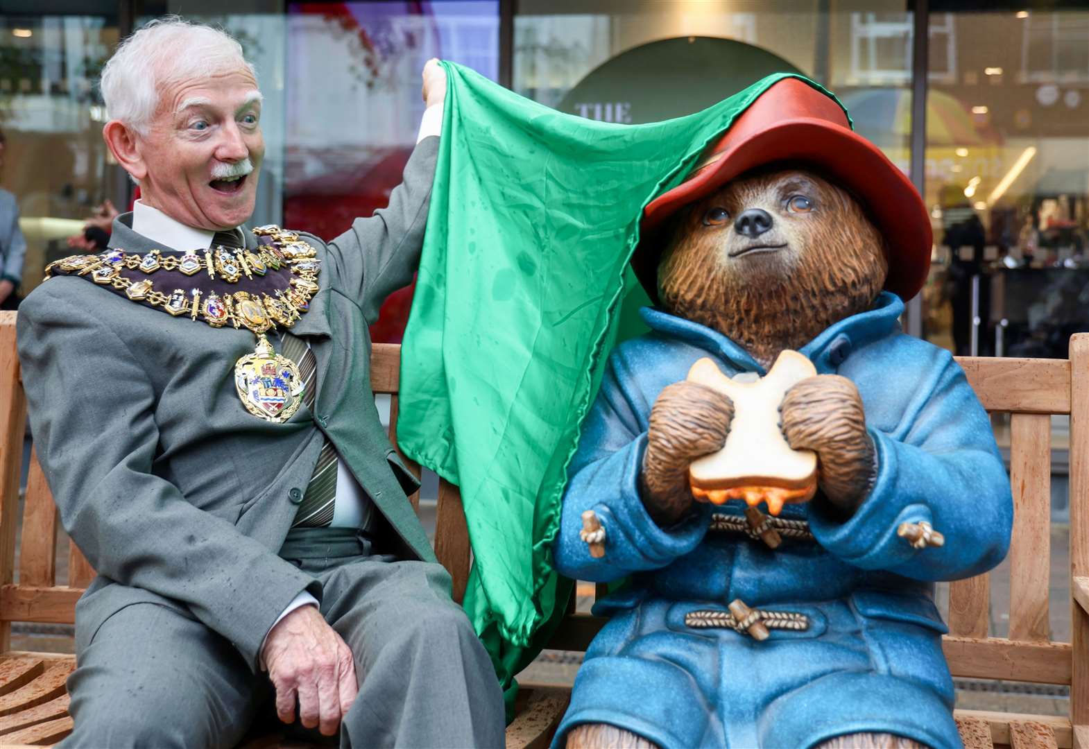 Mayor of Newbury Andy Moore unveiling new Paddington Bear bench in Newbury