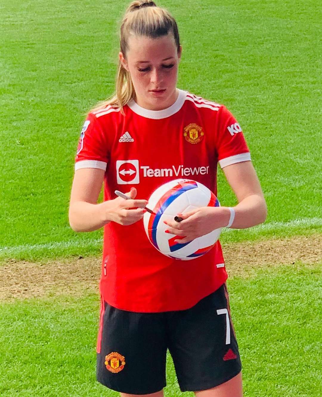 Ella Toone signing Lily's ball Picture: Jon Berry