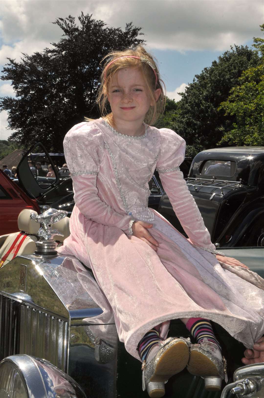 Rosie Bucknell, seven, on a 1927 Rolls Royce, pictured by Geoff Fletcher