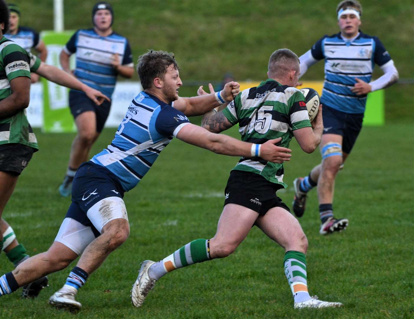 Ali Magee looks to halt Tottonians full-back Ethan Riley’s progress