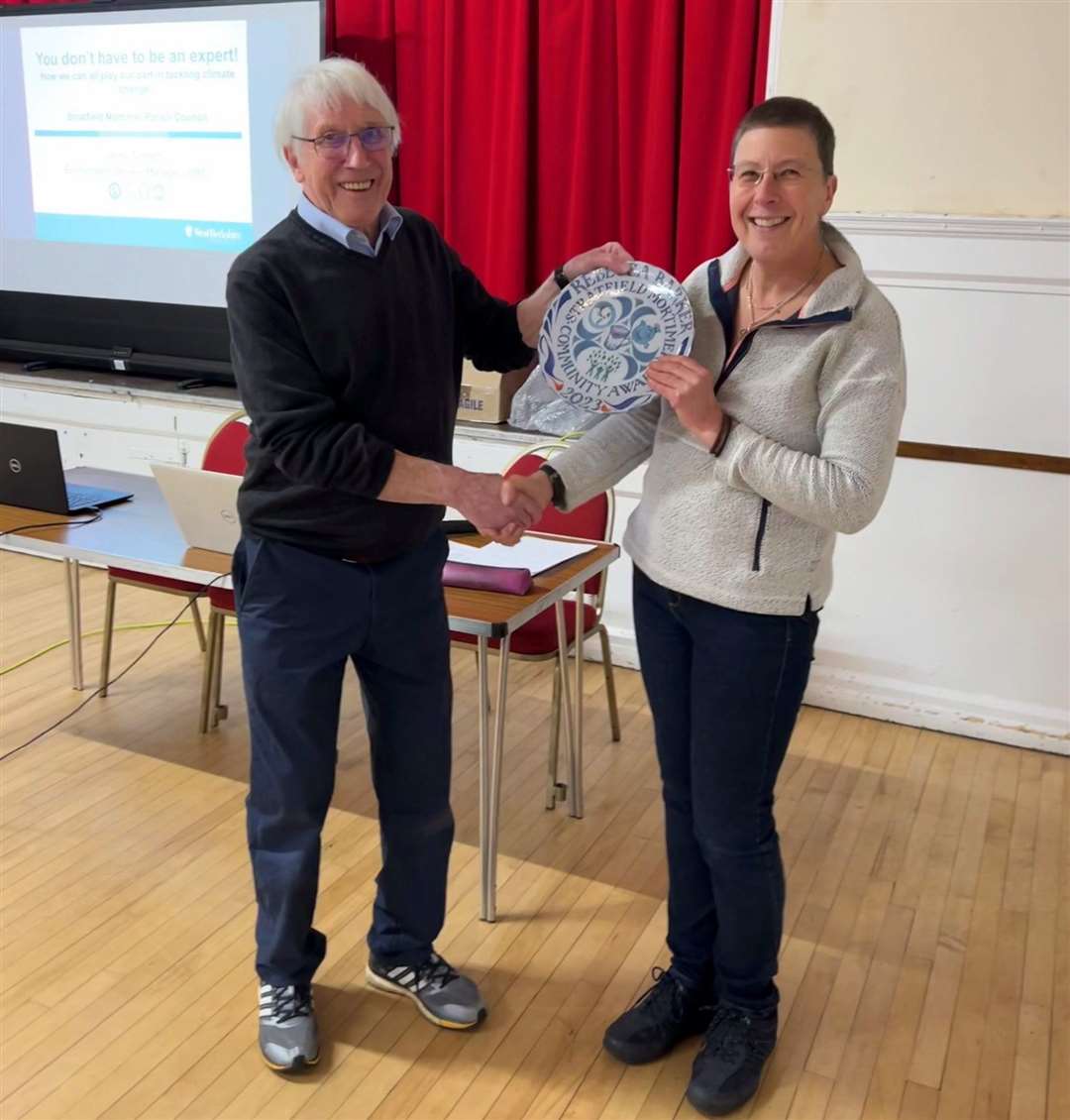 Cllr Mike Dennett presenting Rebecca Barker her award. Credit: Nick Carter