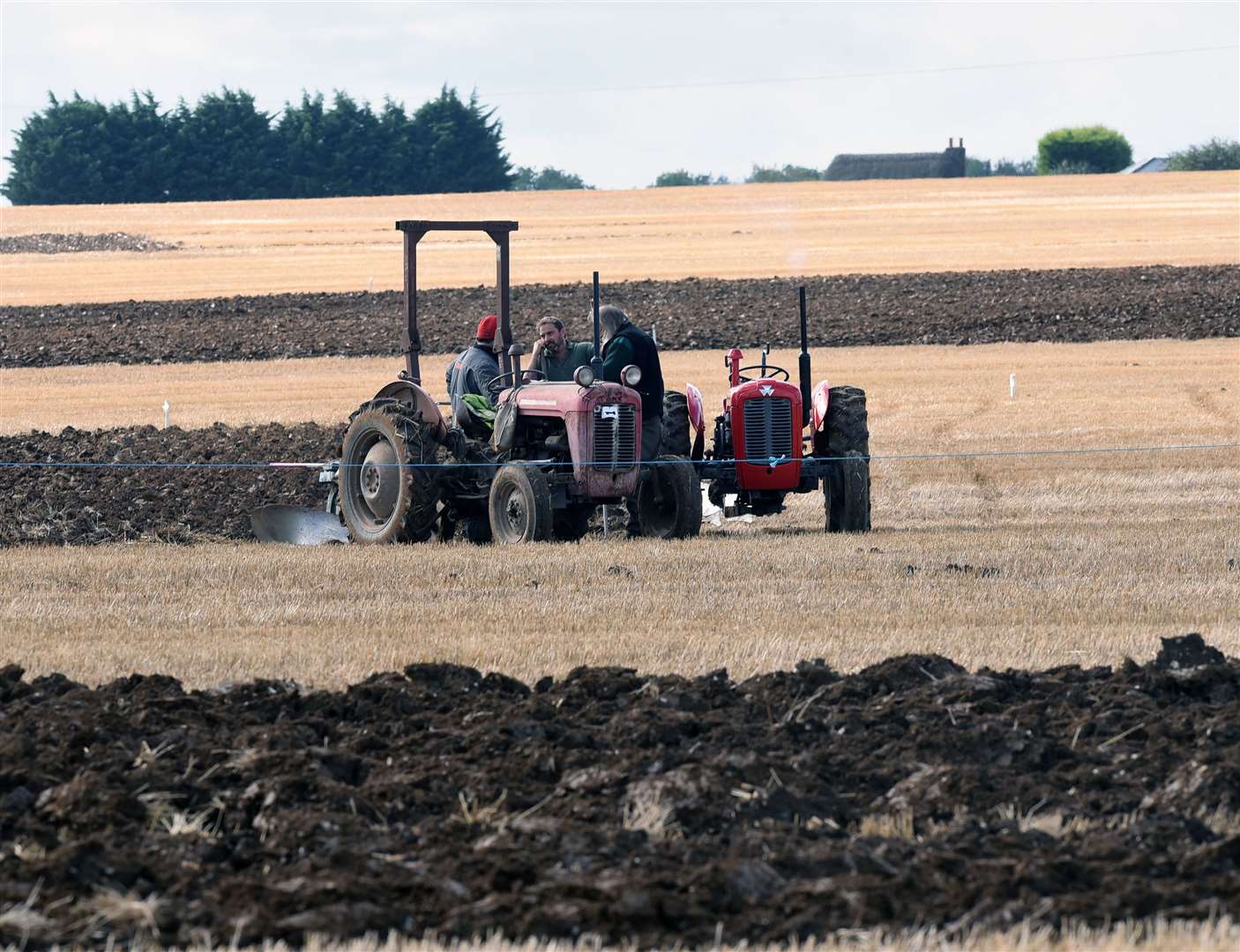 Time for a chat while ploughing!