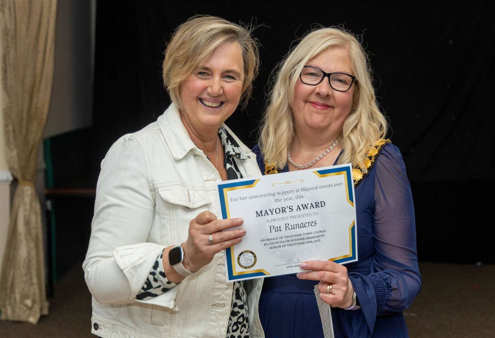 Mayor presenting an award to local reflexologist Pat Runacres