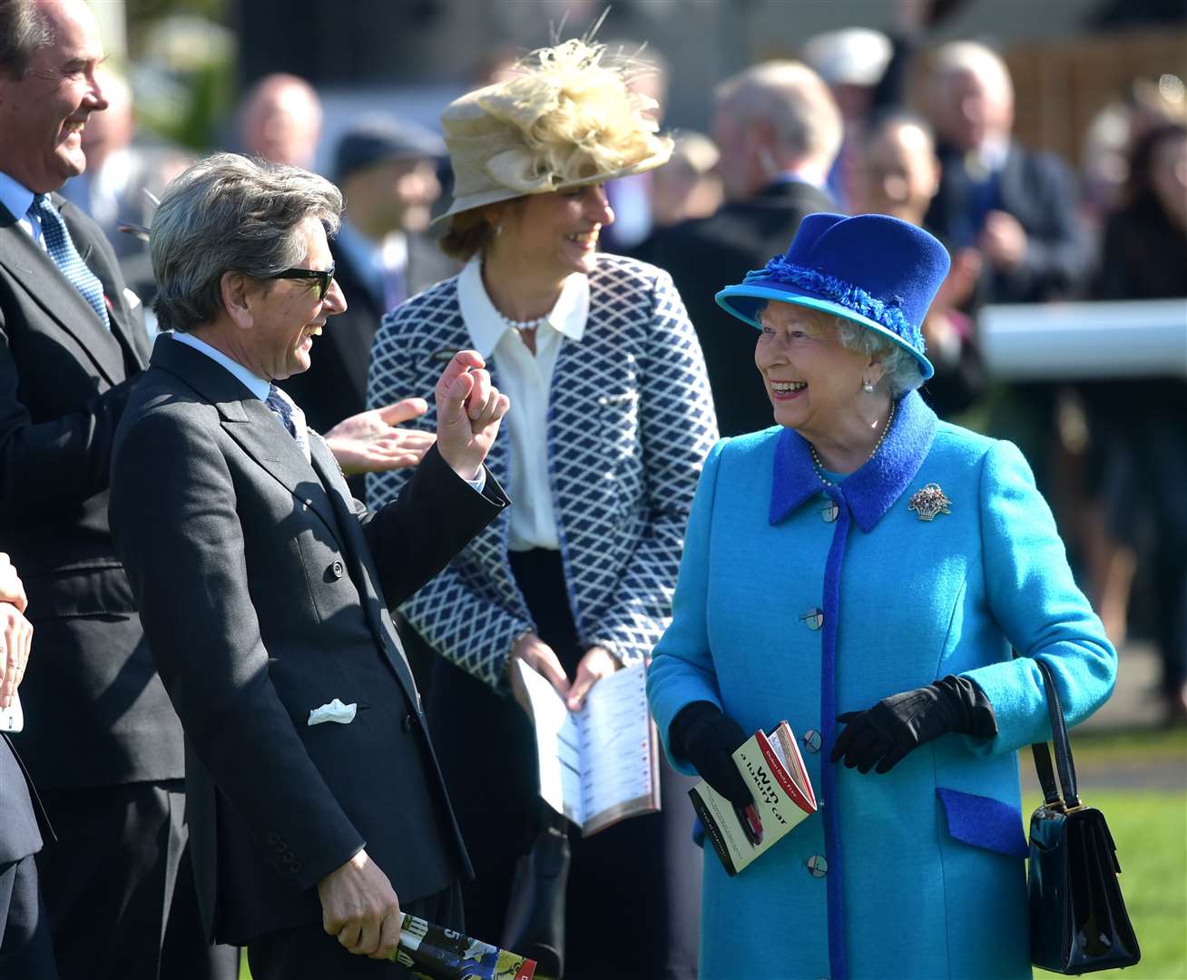 The Queen reflects on the finest margin of victory at Newbury with her racing manager, Highclere's John Warren