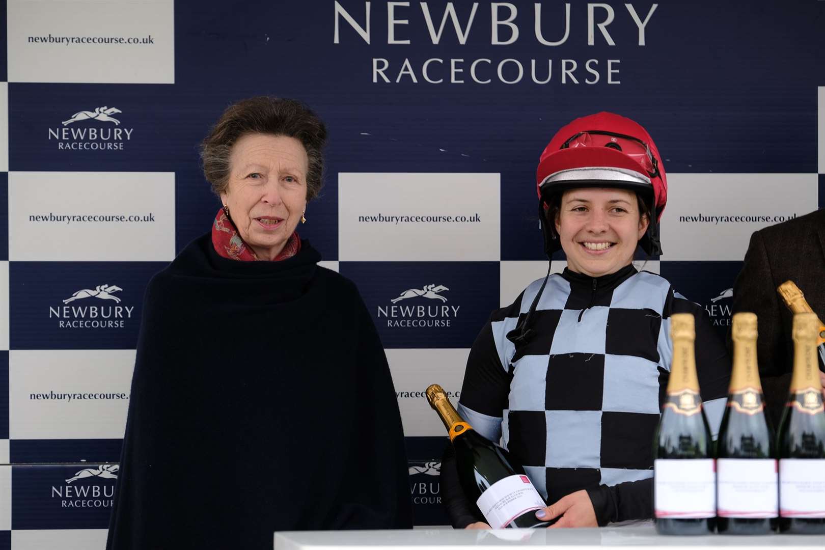 The Princess Royal presents winning jockey Amy Ferris with her prize