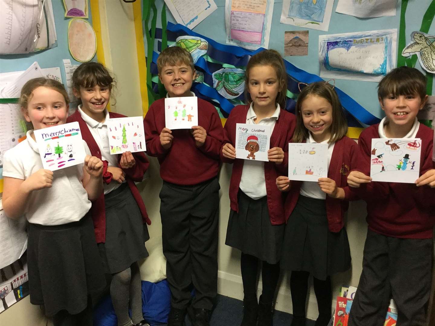 The year 4 pupils with their handcrafted Christmas cards. Picture by: Spurcroft Primary School. (53806134)