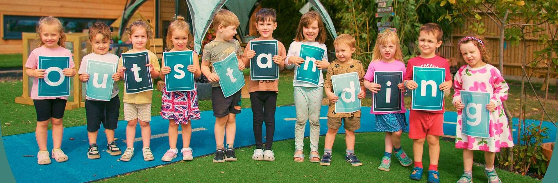 Children at Rocking Horse Nursery in Newbury Racecourse celebrate learning of Ofsted's Outstanding verdict on their inspection