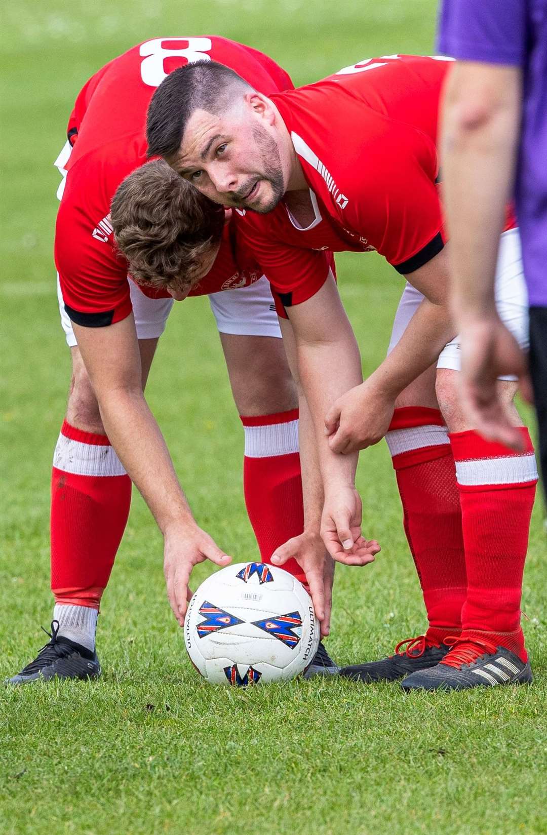 Kingsclere prepare to take a free kick - Photo: Wilf Springer