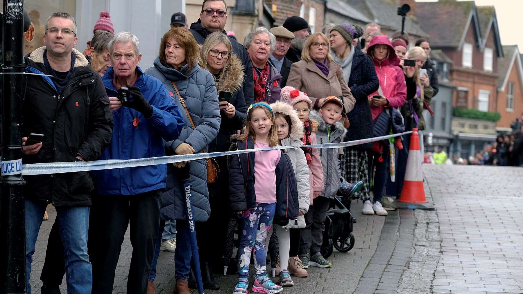 Keen observers wait to capture the parade on Newbury Bridge