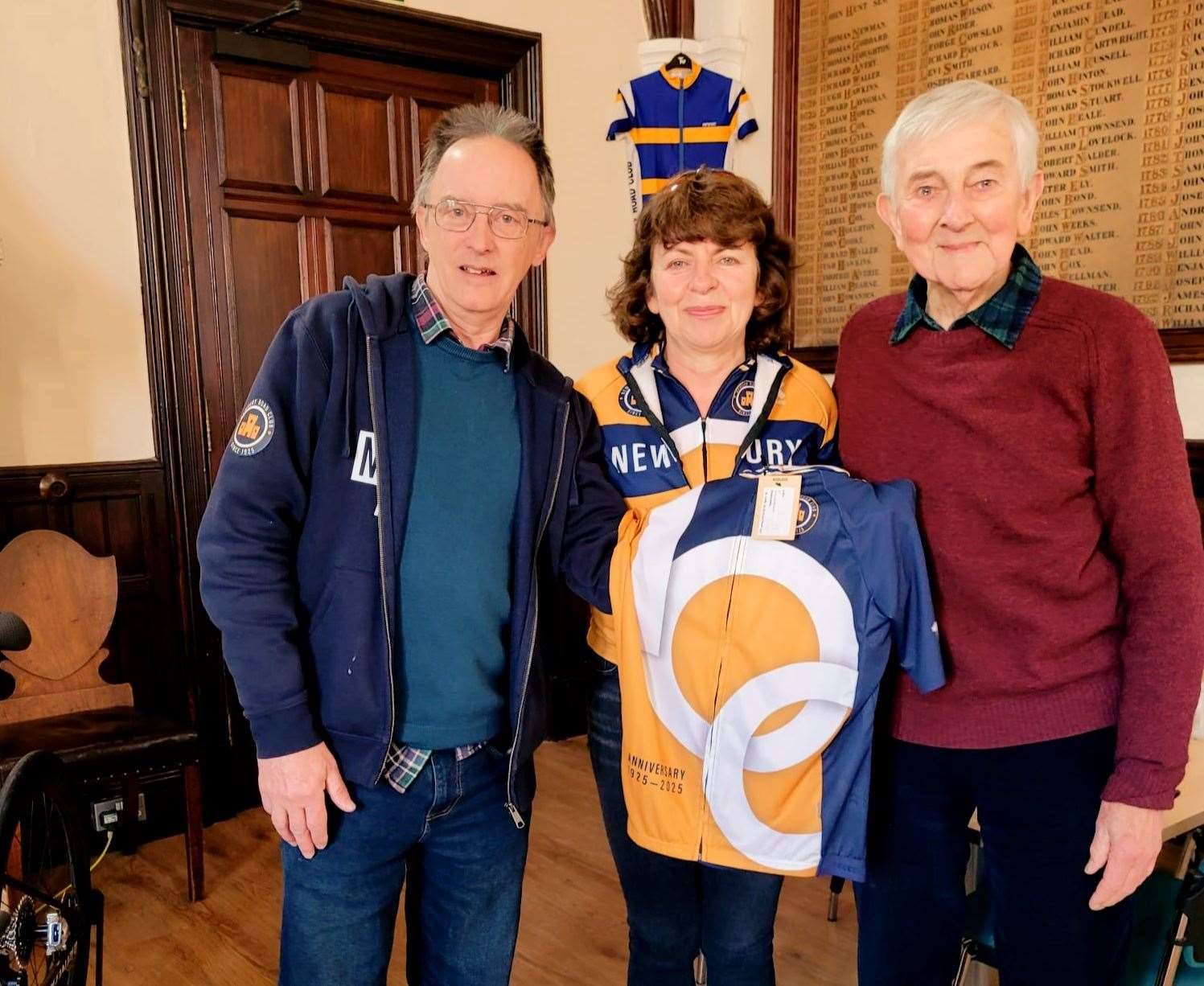 Dave Portwood and Lorraine Murrell present Club Veteran, Joe Newman, with a 2025 Centenary Shirt.