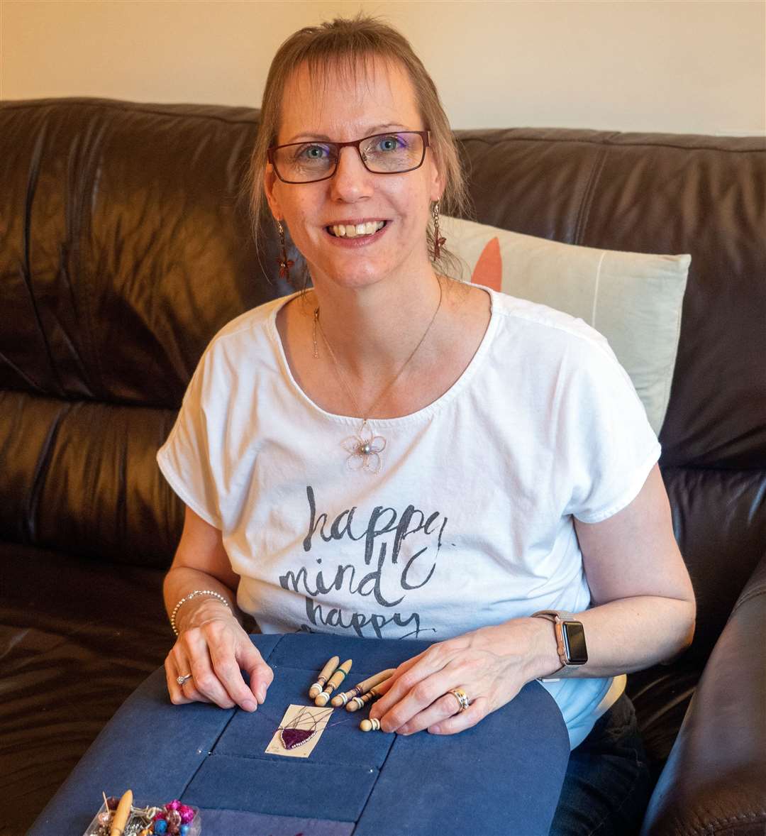 Jane Fullman working at lace pillow
