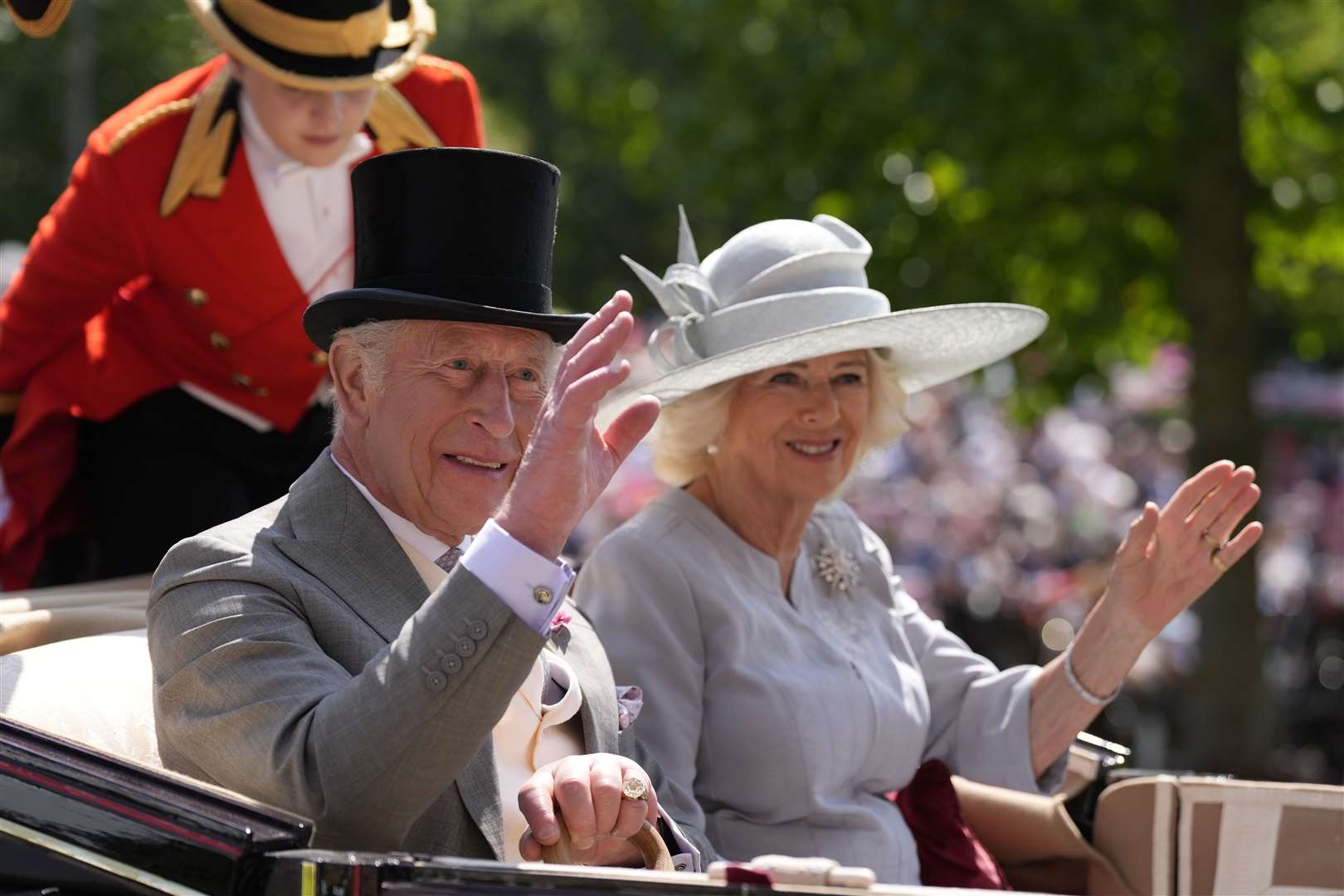 The King and Queen arrive in the royal carriage (Andrew Matthews/PA)