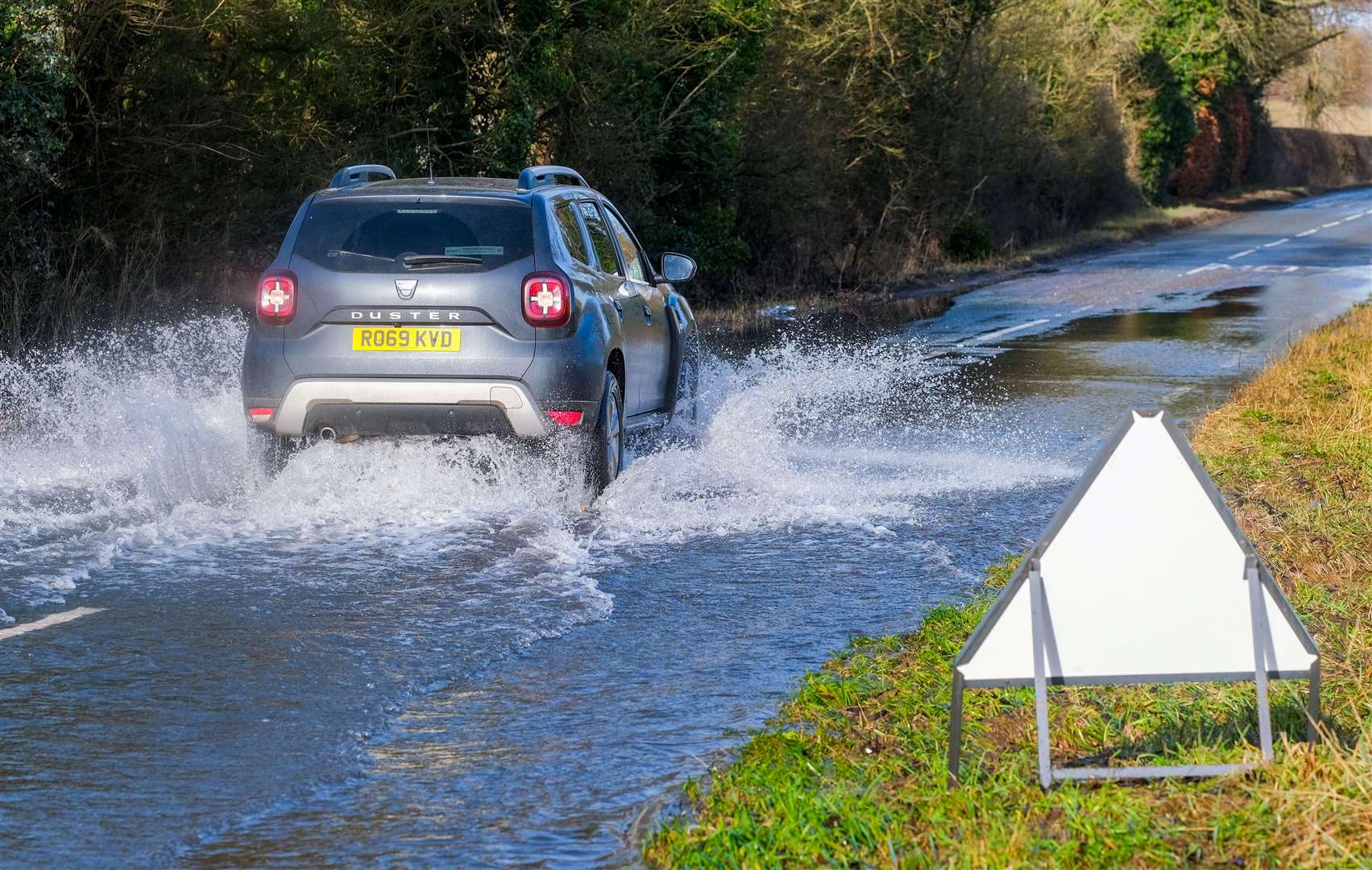 Potholes covered in flood water along B4494