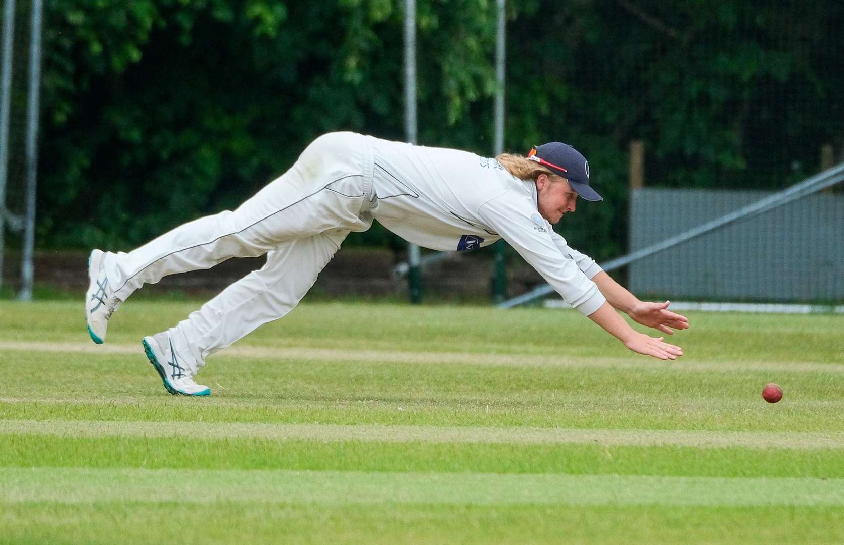 Elliot Seddon, who took two wickets with the ball, diving in the outfield