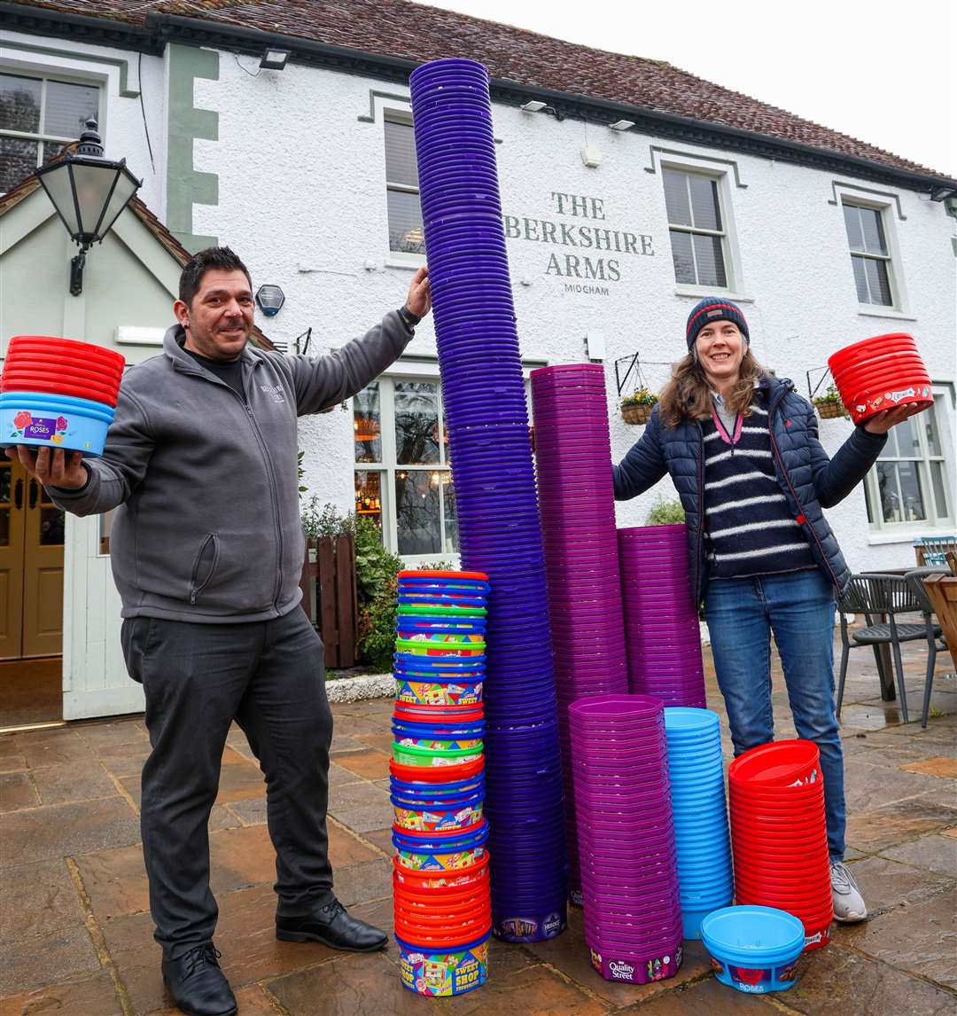 General Manager Andreas Maragkos and Jenny Kirby with towers of gold outside the pub