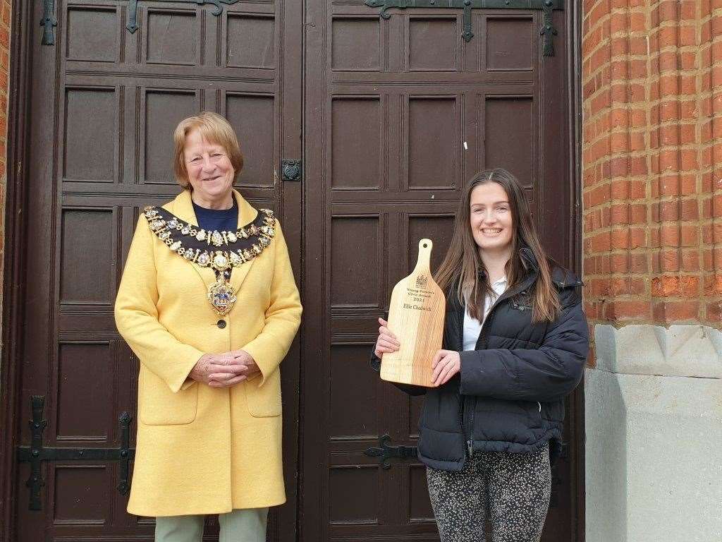 Ellie Chadwick is presented with her award by Elizabeth O'Keeffe
