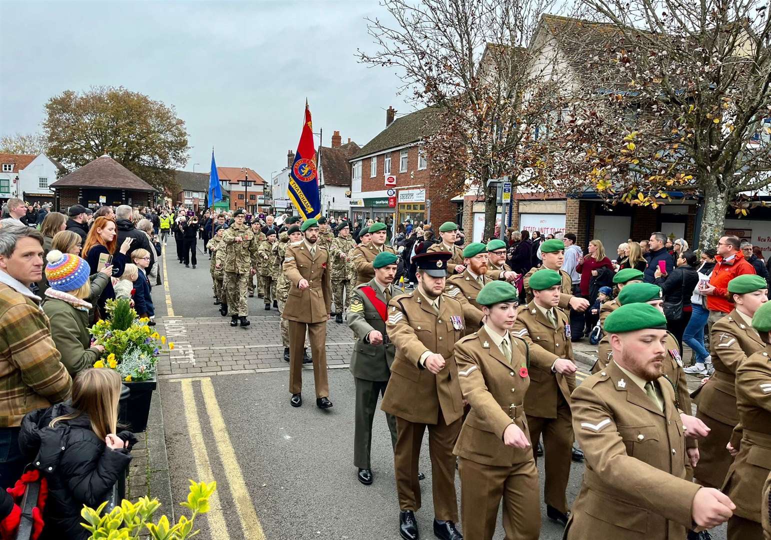 Uniformed personnel marching through the Broadway