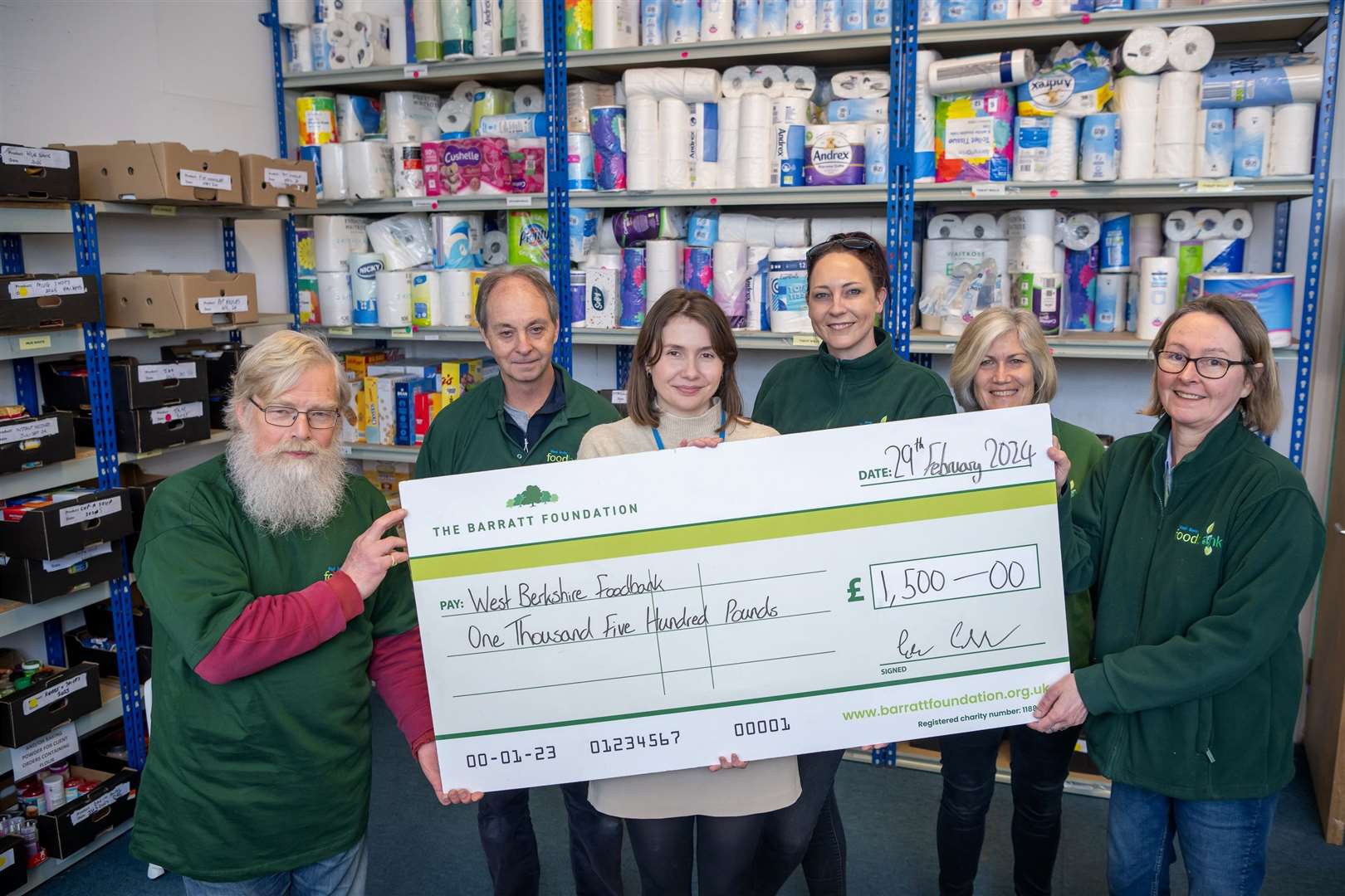 Vicky Heyes from David Wilson Homes presenting the cheque for £1,500 to West Berks Foodbank