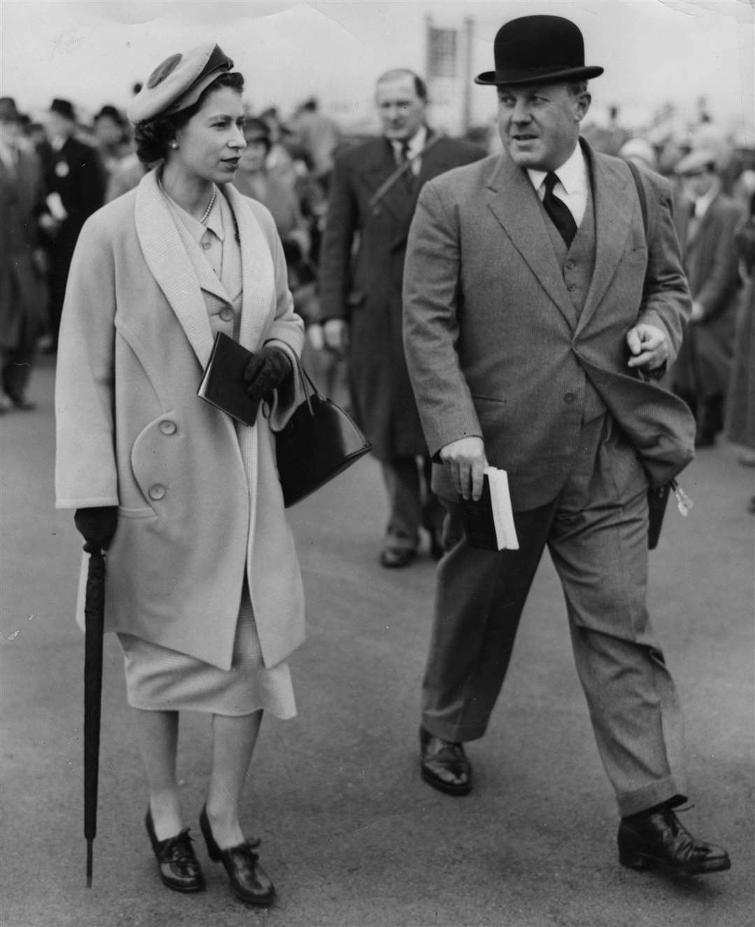 Queen Elizabeth II at the Newbury races. This was the first royal visit to the course since King George V saw his horse, Limelight, win the Spring Cup in 1933