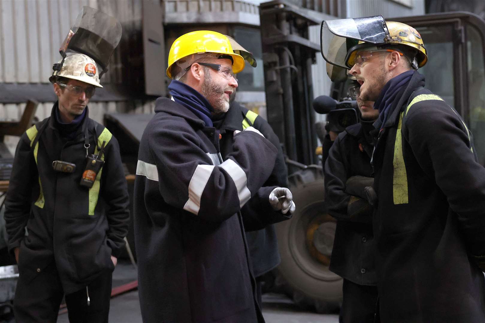 Business Secretary Jonathan Reynolds, second left, talks with workers during a visit to the British Steel site in Scunthorpe (Darren Staples/PA)
