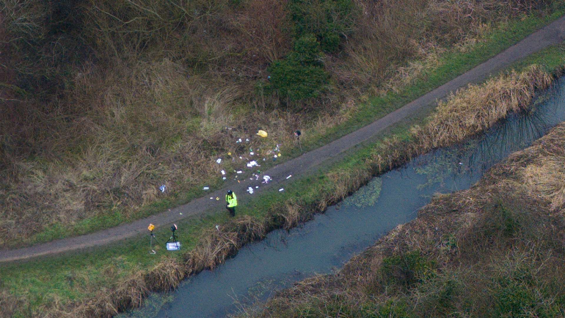 A police officer at the scene on Scribers Lane (Jacob King/PA)