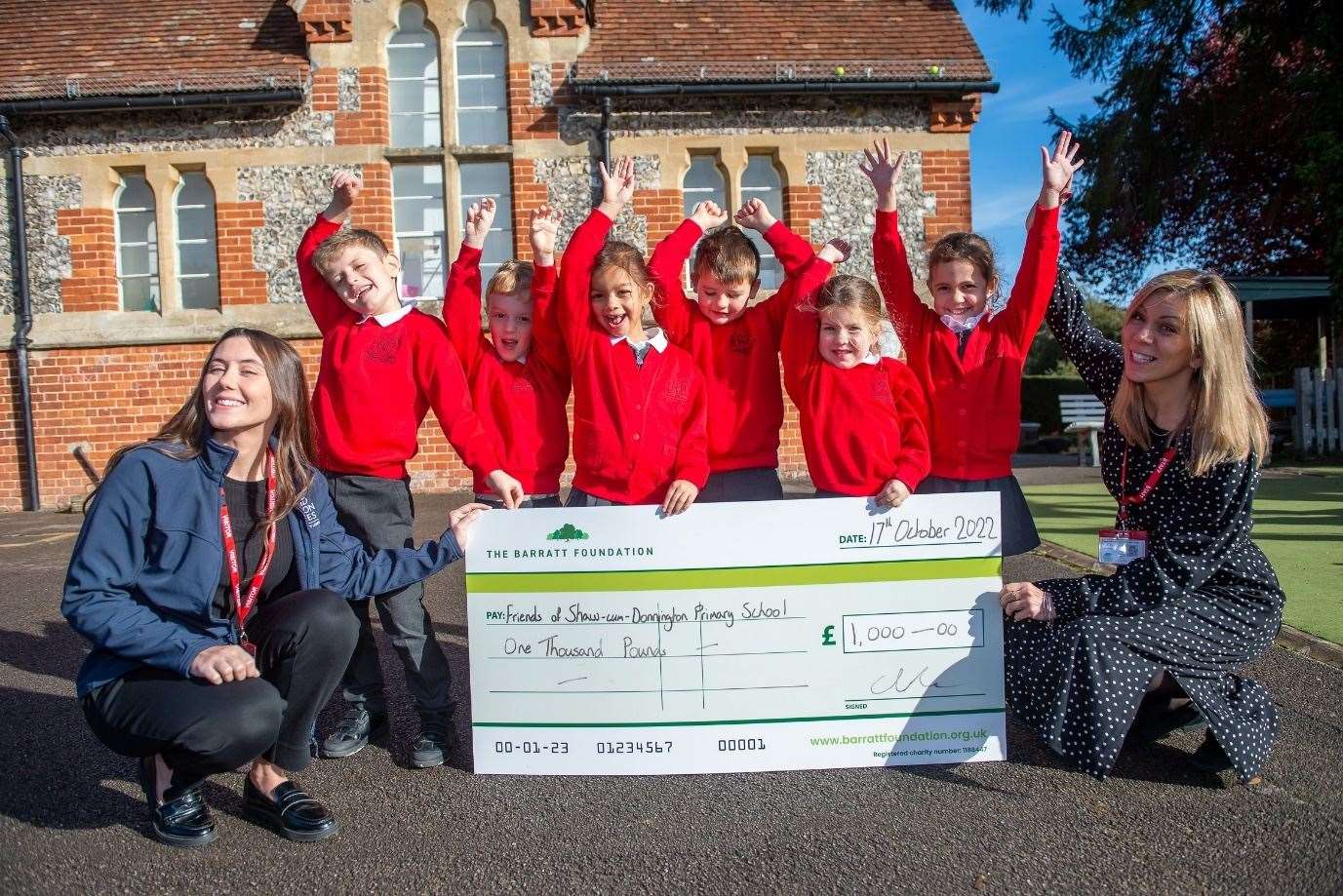 Shaw-cum-Donnington Primary School pupils celebrating the donation