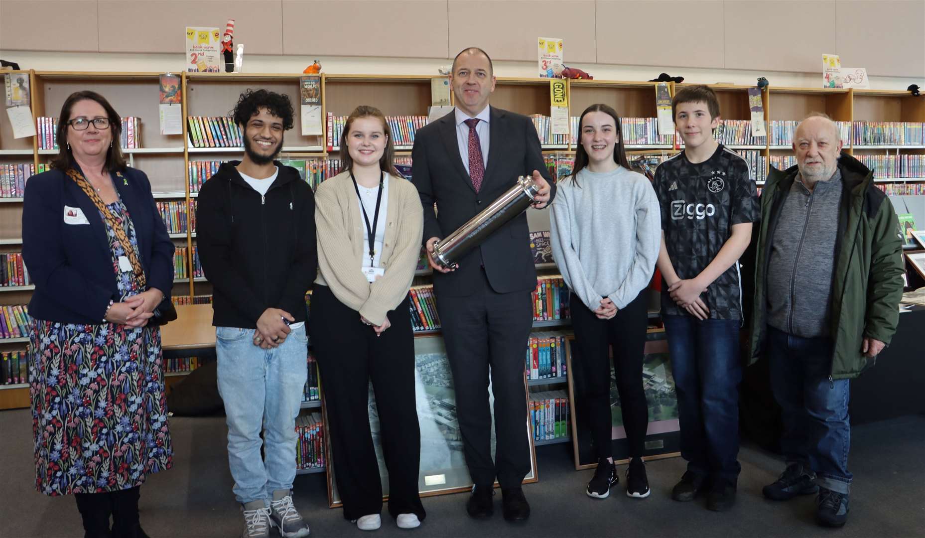 Headteacher David Ramsden, centre, joined by pupils with the time capsule