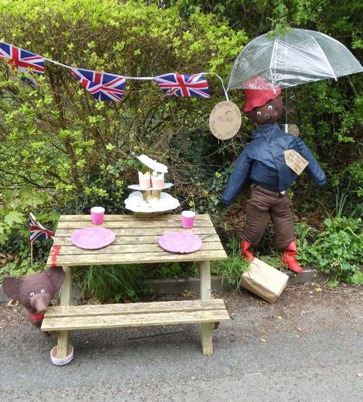 Various handmade royal scarecrows dotted around the village