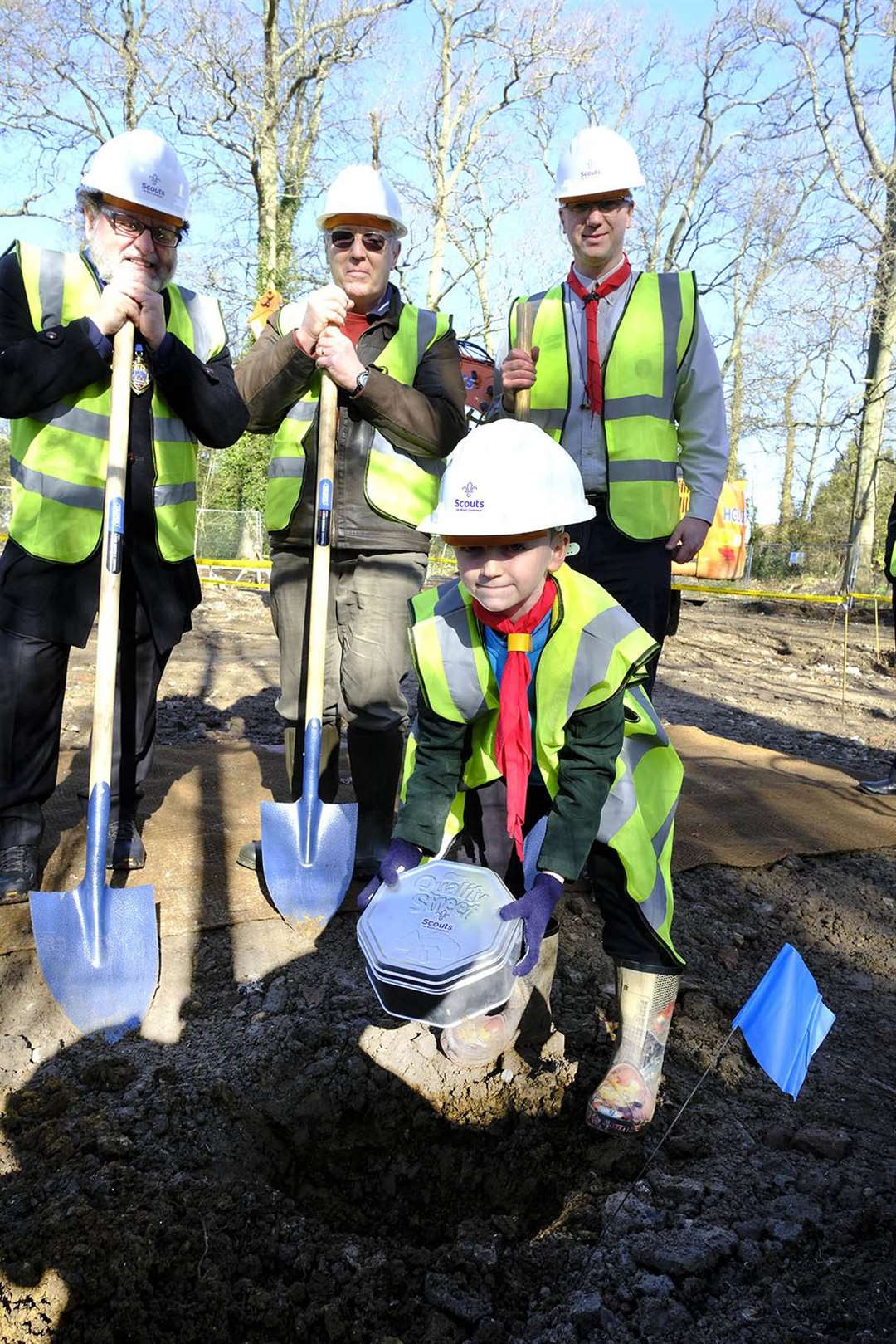Beaver Toby Daniels, 7, burying a time capsule which includes a front page from the NWN, watched by deputy mayor Gary Norman, former chairman Eugene Futcher and group Scout leader Rob Daniels