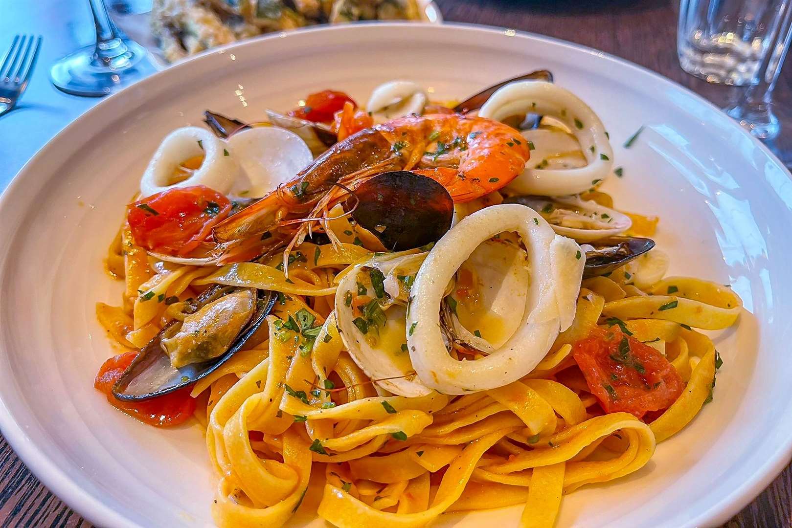 Tagliatelle Nino (£18.20), egg noodles with clams, mussels, king prawns, squid, cherry tomatoes and a touch of tomato sauce