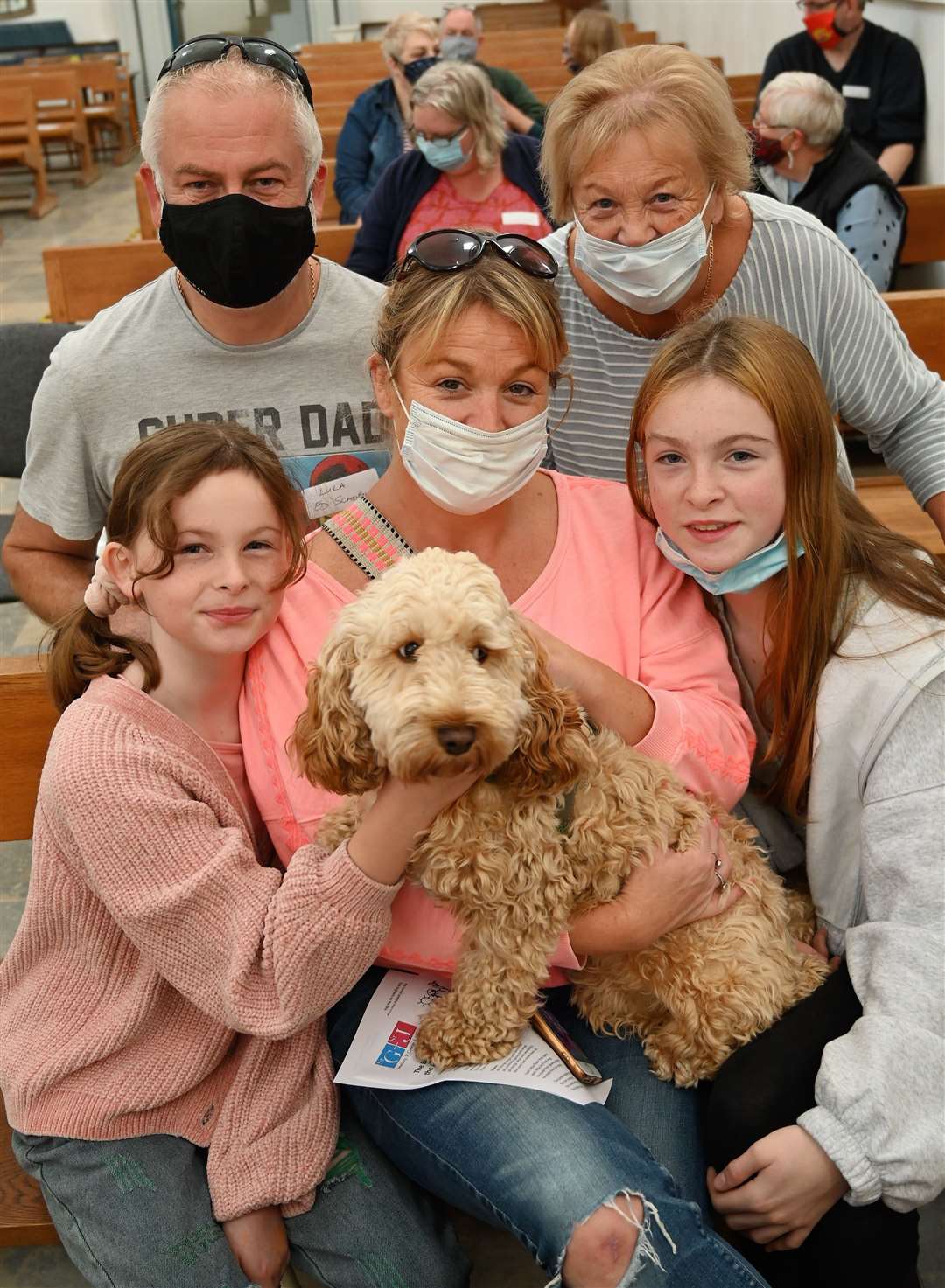 Ed Schofield and Janis Blake (back row) with (seated) Tina Schofield and her daughters Poppy (10) and Lily (12), with Cockapoo Lula.