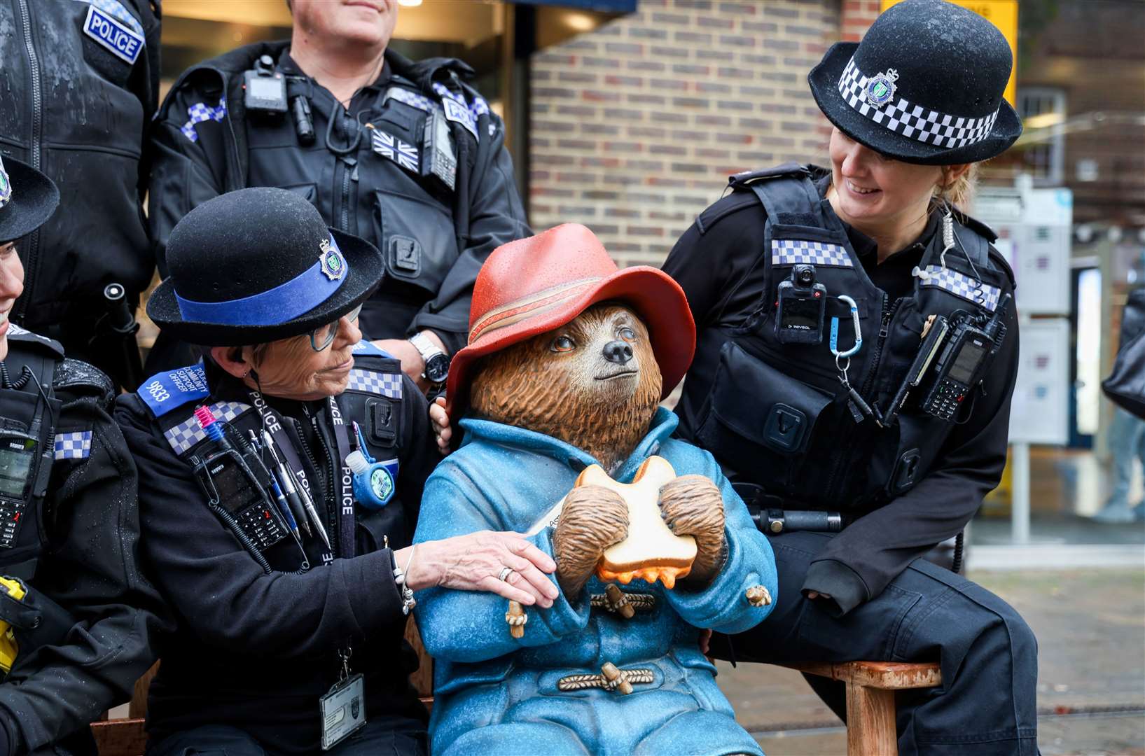 Police enjoying the new Paddington Bear bench in Newbury