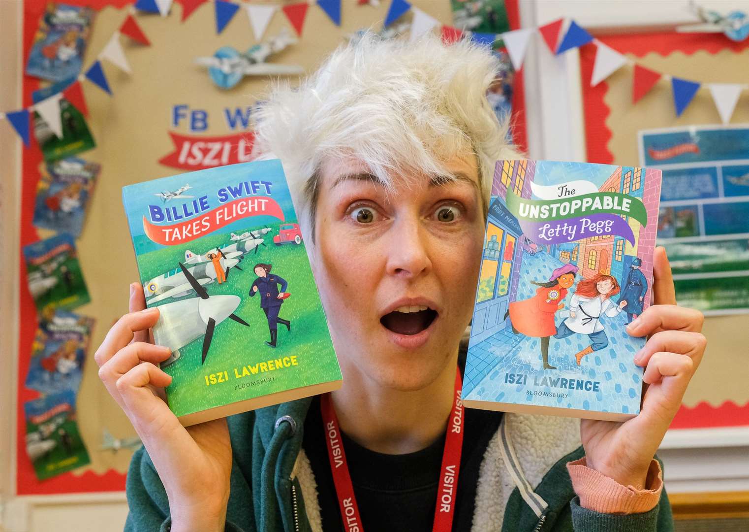 Author Iszi Lawrence with her latest book and her very first book