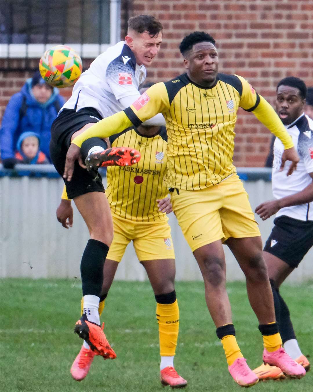 Jack Wright, seen here competing for a header, is set to miss Tuesday night’s visit of Gosport Borough