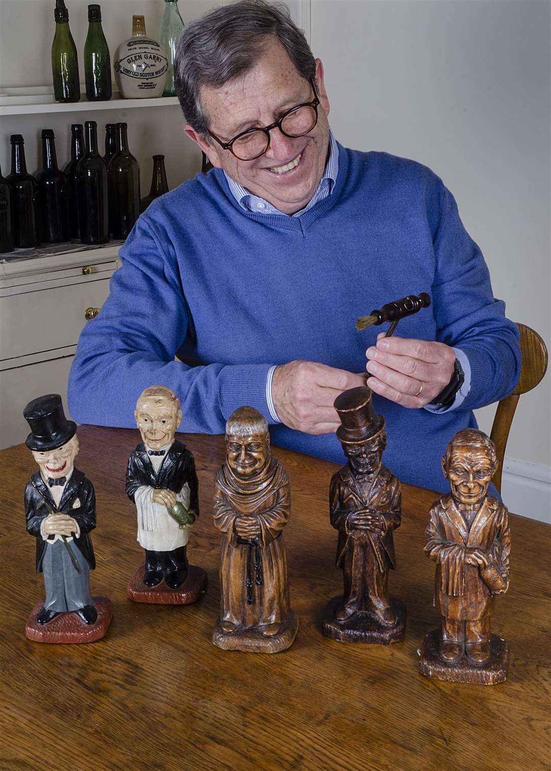Francois Touzin with some of his collection of vintage corkscrews