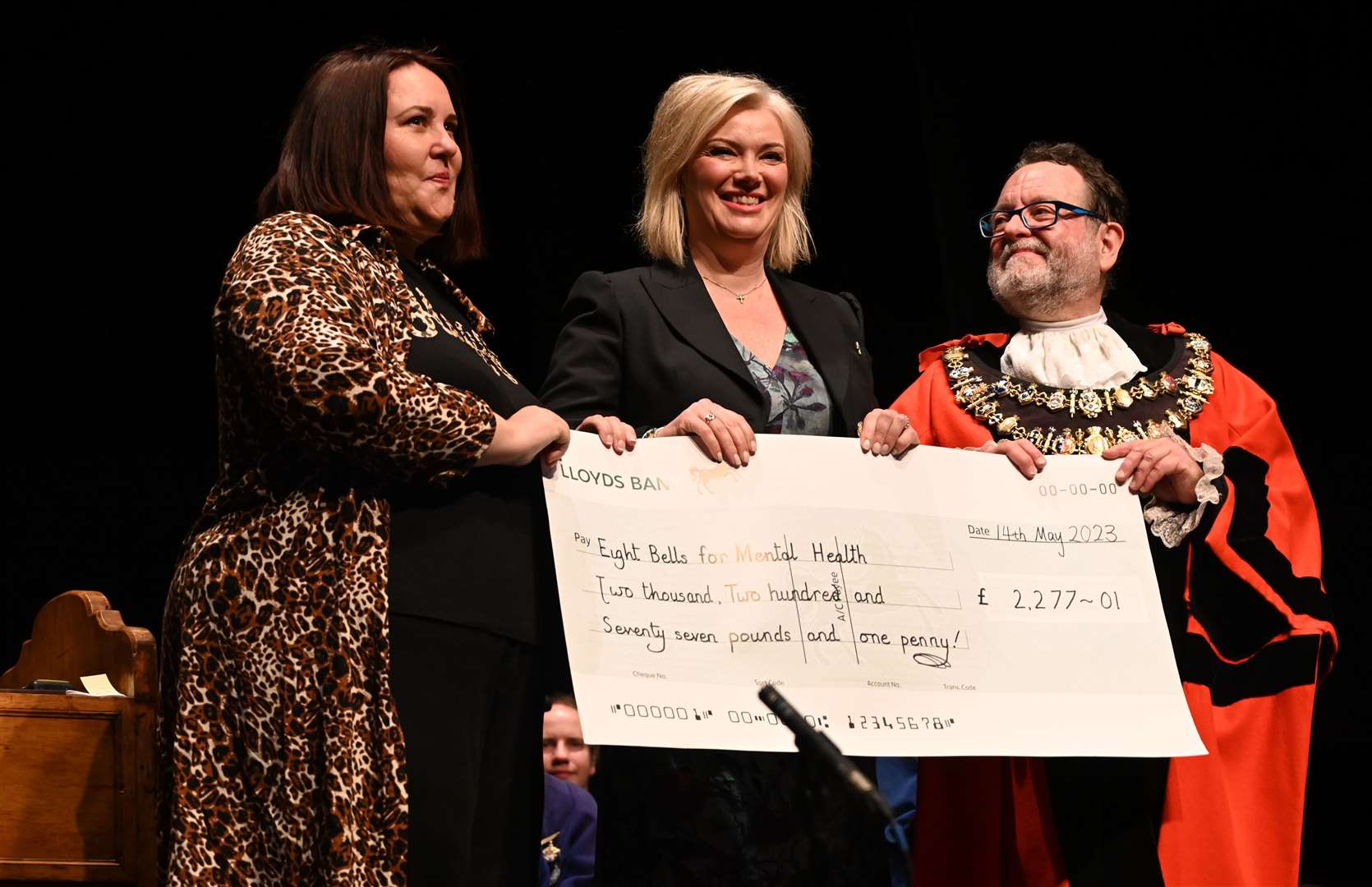 Outgoing mayor Gary Norman presenting a cheque of £2,277.01 to mental health charity Eight Bells for Mental Health, one of his chosen charities