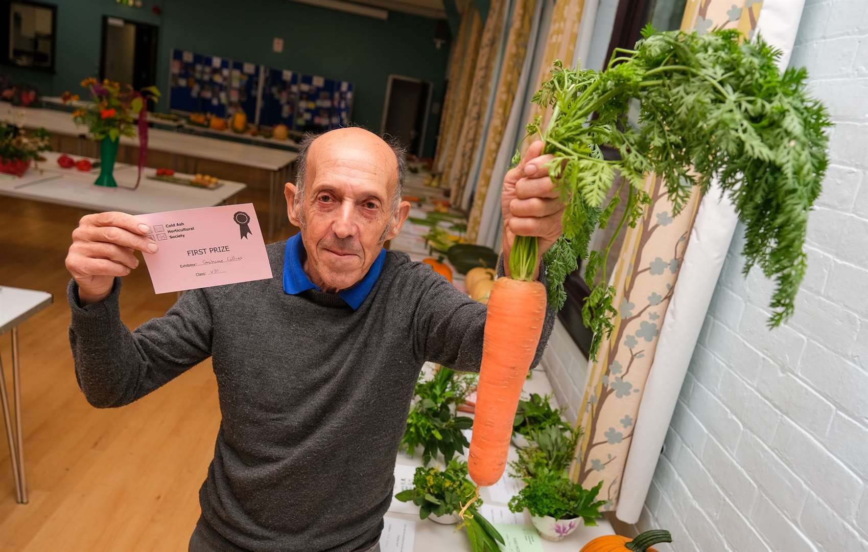 Grahame Collins with his winning longest carrot. Picture by Phil Cannings
