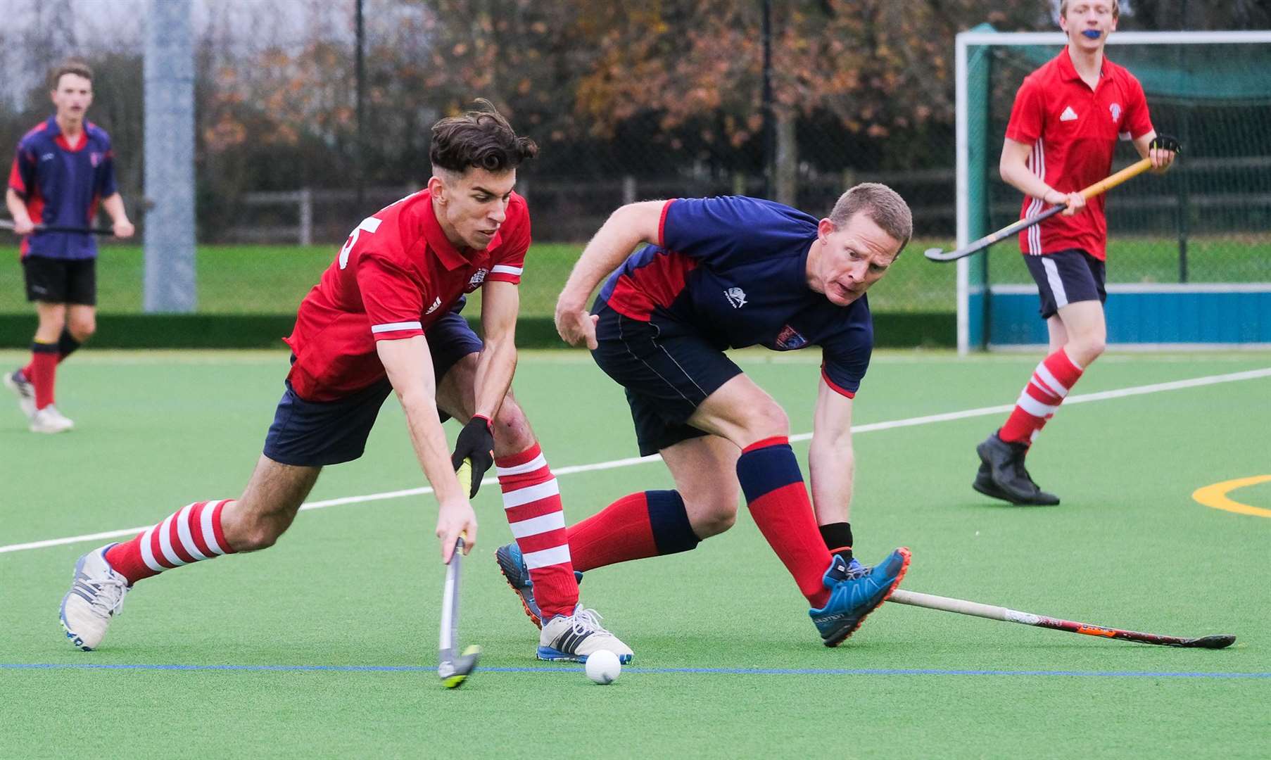 A Newbury player carries the ball forward
