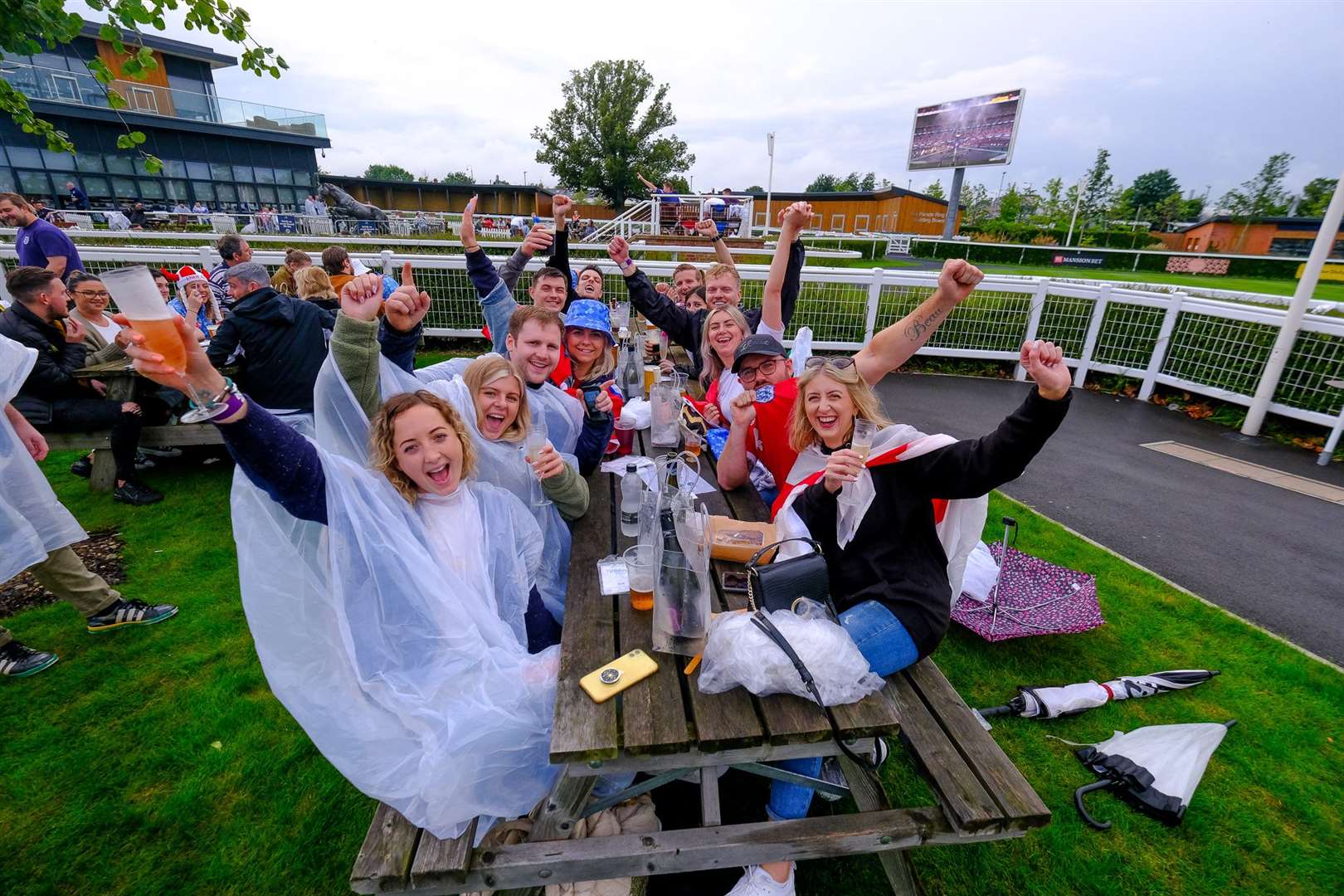 England fans watch the game at Newbury Racecourse.Ref: 28-0921.. (49111963)