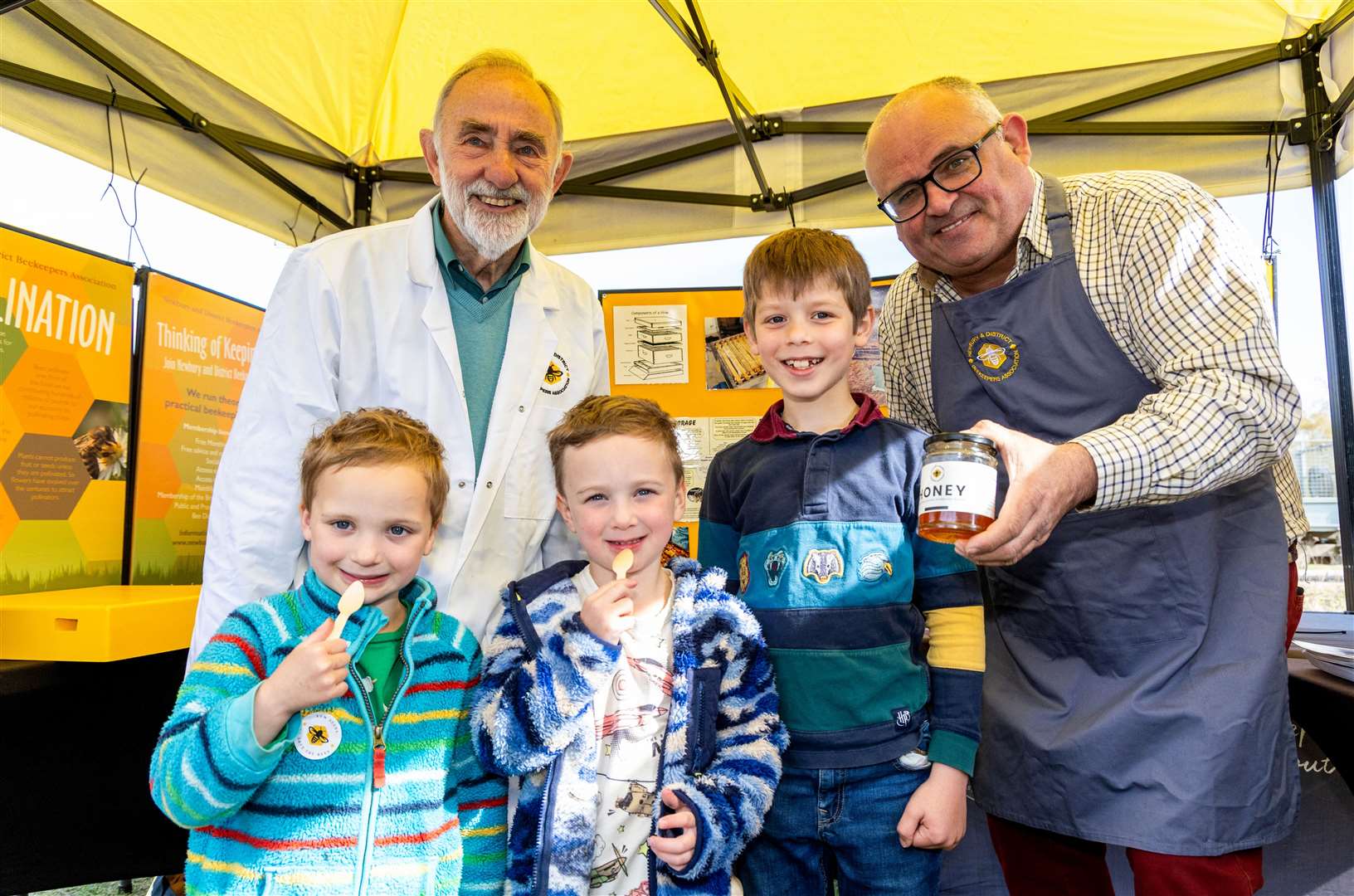Little ones tasting honey with Newbury and District Bee Keepers