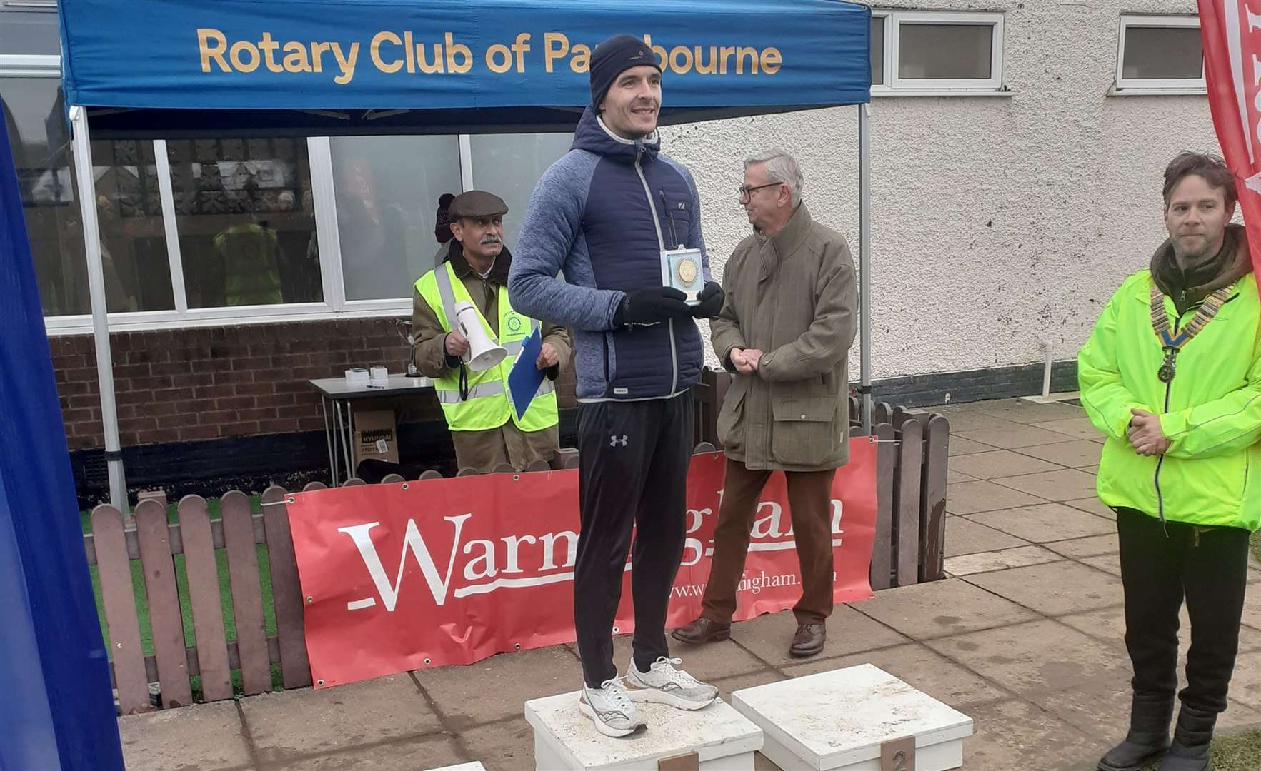 Overall winner Chris Lucas with sponsor Bob Warmingham and club president James Richardson at the trophy presentation