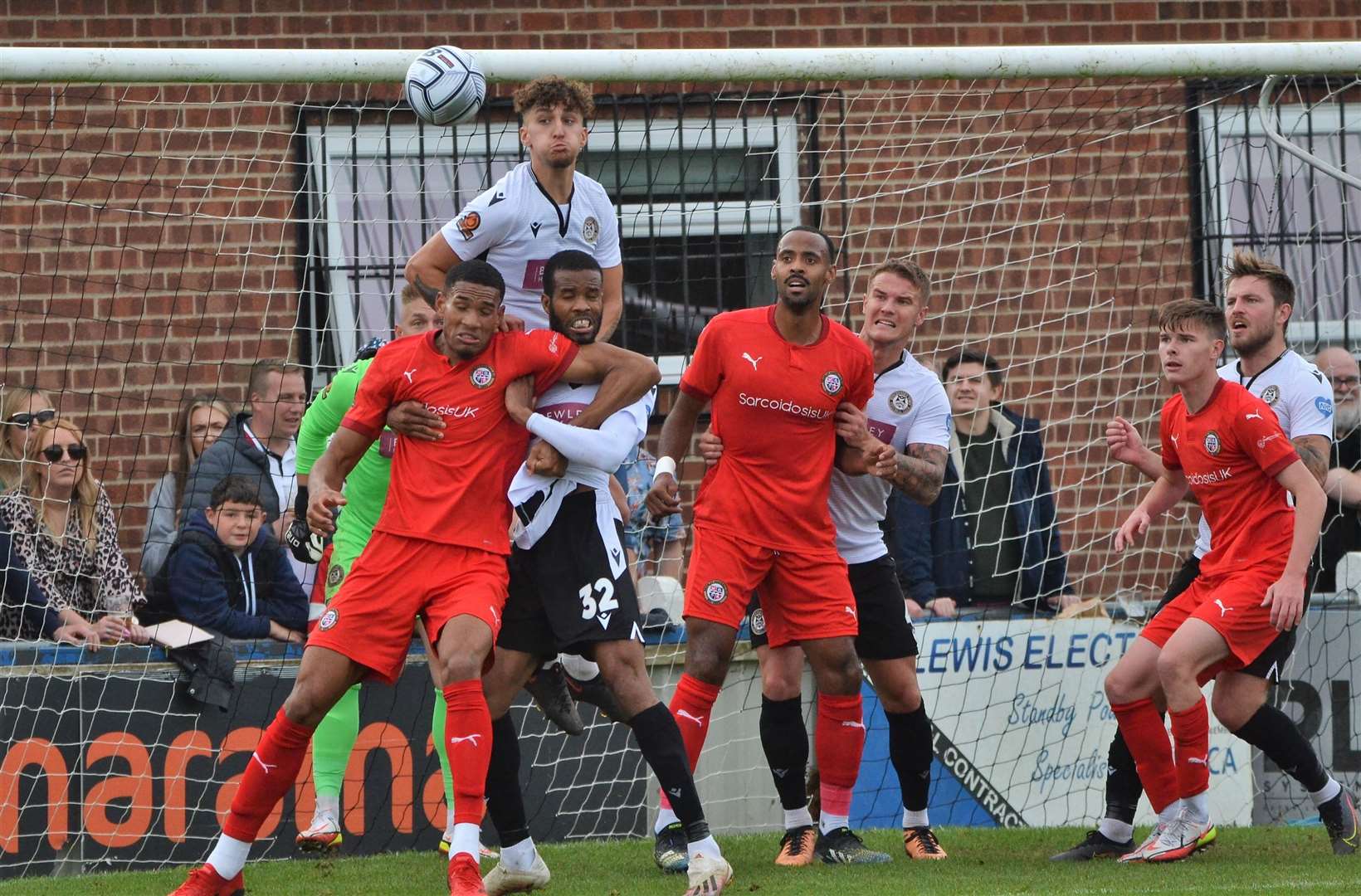 George Smith heads the ball clear