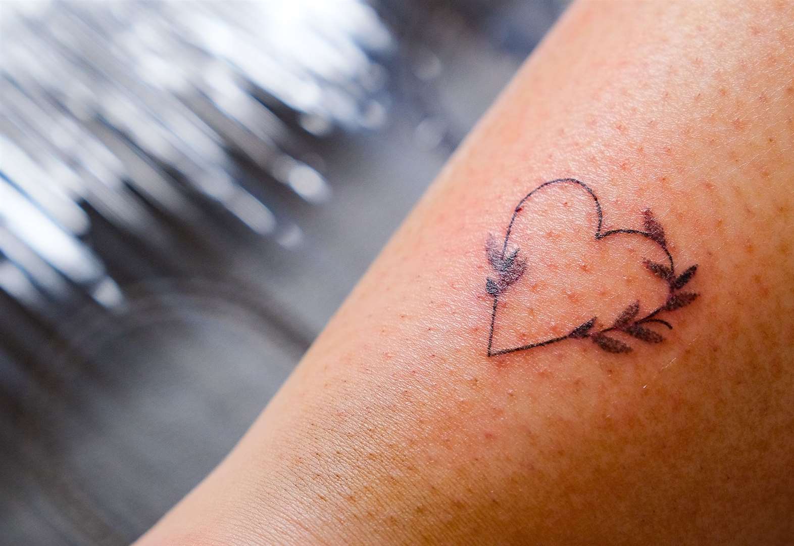 The tattoo designs all followed a similar theme in a bid to create matching badges for heroes.