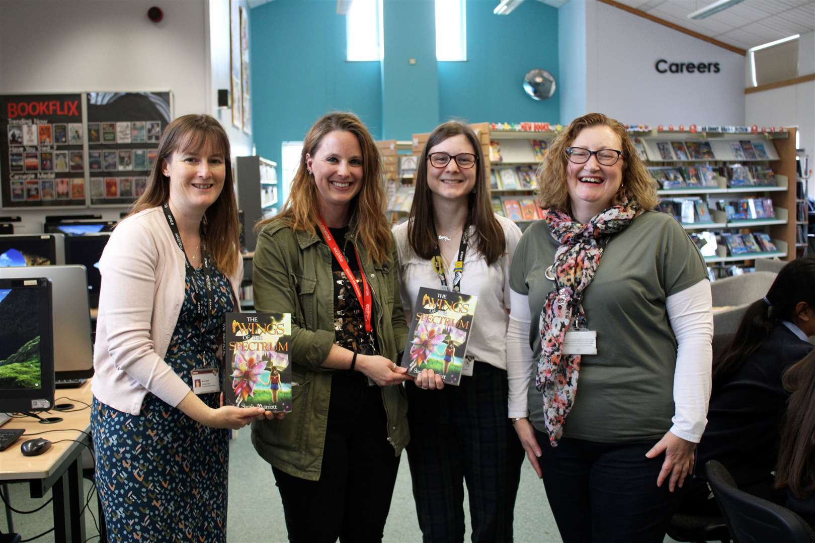 Author, Sarah Marriott, posing with staff in the School Library
